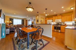 a kitchen and living room with a table and chairs at Elk Meadow Cabins 9A Prairie Creek Suite in Orick