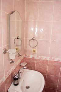 a bathroom with a sink and a mirror at Deep Purple Bikers in Fethiye