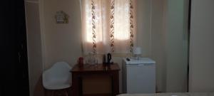 a bathroom with a window and a washing machine at Guest House LIBU Zugdidi in Zugdidi +29 photos