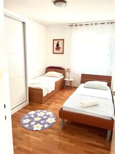 Postel nebo postele na pokoji v ubytování Apartment Split-Dvor