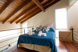 เตียงในห้องที่ La Casa de Mona en Bariloche