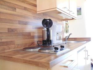 a kitchen with a coffee maker on a counter at Allgäu Sonne in Oberstdorf