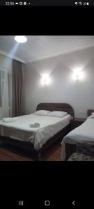 Voodi või voodid majutusasutuse Small guest house toas