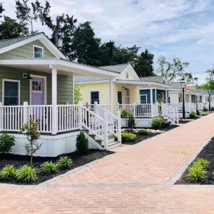a row of houses on a brick road at Cape cottage inn in Cape May
