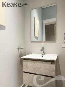 a bathroom with a sink and a mirror at Kease Ar Rabi F-7 Luxurious Creativity GX12 in Riyadh