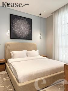 a bedroom with a bed and a picture on the wall at Kease Ar Rabi F-7 Luxurious Creativity GX12 in Riyadh