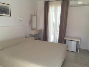 Postel nebo postele na pokoji v ubytování Hotel Spanelis