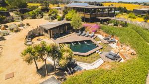 an aerial view of a house with a swimming pool at Cuarzo Lodge in Pichilemu