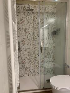 a shower in a bathroom with a toilet at La casa degli innamorati in Bari +7 photos