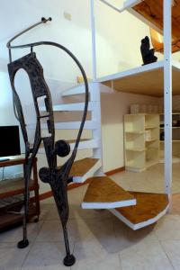 a glass staircase in a room with a desk at Termini Loft in Rome