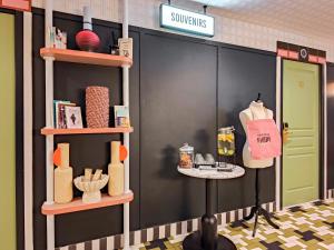 a store front with shelves of products on the wall at Aparthotel AMMI Nice Lafayette in Nice