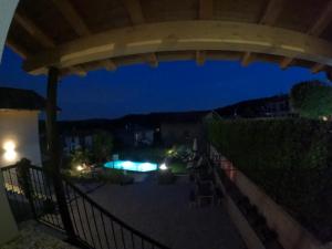 a view from the balcony of a house at night at Casa Charlie in Arcisate
