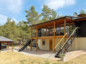a house with a staircase leading up to it at 6 person holiday home in Åhus-By Traum in Åhus