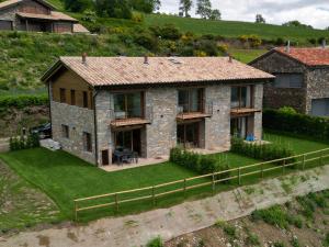 an aerial view of a house on a hill at Les Casetes de Molló in Molló