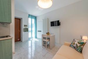 a living room with a couch and a table at La Casa del Pescatore in Cernobbio