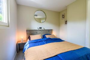 Postel nebo postele na pokoji v ubytování Gezellig ingericht vakantiehuis op de Veluwe