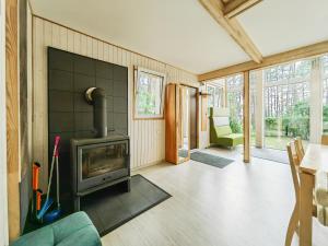 a living room with a fireplace in a house at River bank vacation home in Jūrmala