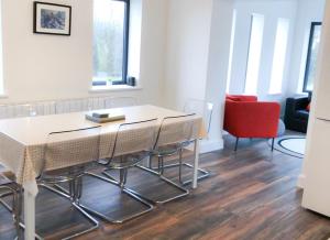 a dining room with a table and chairs at Bell View Holiday Home Sheeps Head in Bantry