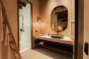 a bathroom with a sink and a mirror at Makani Luxury Cartagena in Tierra Bomba