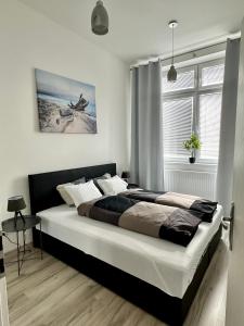 מיטה או מיטות בחדר ב-Oskar Wilde