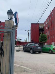 a group of cars parked in a parking lot at Sulaj Sea view 2 in Himare +5 photos