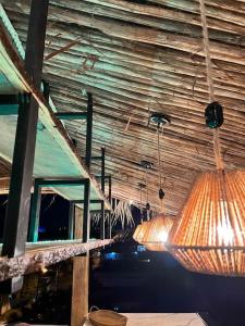a room with some lamps hanging from the ceiling at Lux Ph & Rooftop Terrace to Relax in Santiago de los Caballeros