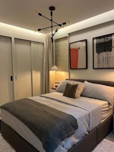 a bedroom with a large bed in a room at Lux Ph & Rooftop Terrace to Relax in Santiago de los Caballeros