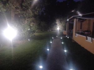 an empty yard at night with street lights at B&B Helios Il Tuo Relax In Sardegna in San Teodoro