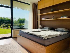 Posteľ alebo postele v izbe v ubytovaní Šumavský apartmán - Nový komfortní a prostorný, se zahradou