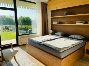 Posteľ alebo postele v izbe v ubytovaní Šumavský apartmán - Nový komfortní a prostorný, se zahradou