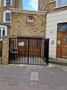 a black gate in front of a building at Armhurst in London