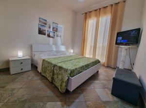 Posteľ alebo postele v izbe v ubytovaní Al Vecchio Carrubo - Lovely 2-rooms house & patio