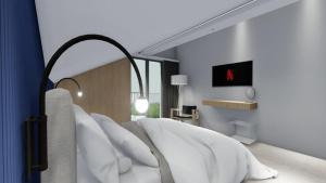 a bedroom with a white bed with white pillows at Luxury Penthouse Hvar with Jacuzzi & Sea View in Hvar