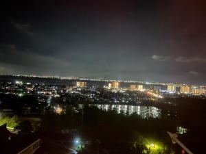 a view of a city at night with lights at FEEL LAKE　VIEW in Otsu