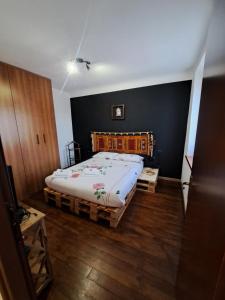 a bedroom with a large bed in a room at Casa Poldo in Cantello