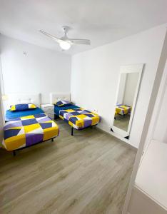 Cama o camas de una habitación en Centro Apartamentos