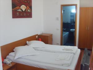 Postel nebo postele na pokoji v ubytování Hotel Flormang