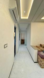 a hallway with two beds in a room at Big appartment near soccer stadium in Tangier in Tangier