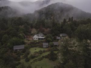 an aerial view of a house in the middle of a forest at Maruia River Retreat in Shenandoah +86 photos