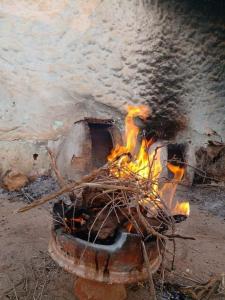 a fire is burning in a brick oven at la perle rare de Sidi Ifni in Sidi Ifni