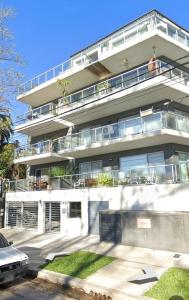 a large white building with a lot of windows at Paseo Victorica - Vista al Río in Tigre