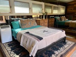 a bedroom with a large bed in a room at Alpine Country Club Lofts in Alpine +10 photos