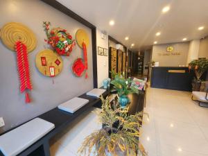 a lobby of a store with decorations on the wall at HOTEL TE AMO in Hai Phong