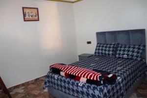 Tempat tidur dalam kamar di Casa del sol Sidi Ifni