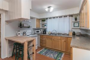 a kitchen with wooden cabinets and a counter top at Casa Azul in Panguitch