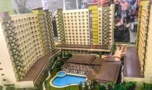 a model of a resort with a pool and buildings at Arthomes BB3 in Mandaue City