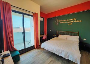 Ένα ή περισσότερα κρεβάτια σε δωμάτιο στο Sofa Potato Homestay