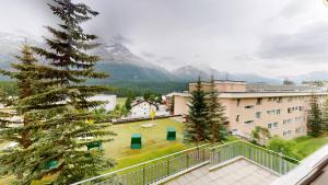 a view from the balcony of a building with a tree at Abitaziun Europa 302 - Champfèr in Champfer