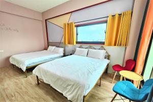 Ένα ή περισσότερα κρεβάτια σε δωμάτιο στο Sofa Potato Homestay