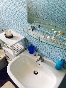 a bathroom with a sink and a mirror at Zahir da Cleo in Castro di Lecce +53 photos
